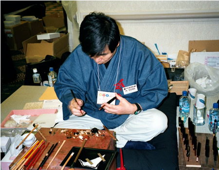 Maki-E artist Hideaki Sone from Japan demonstrates the art of Japanese lacquer pen decoration.